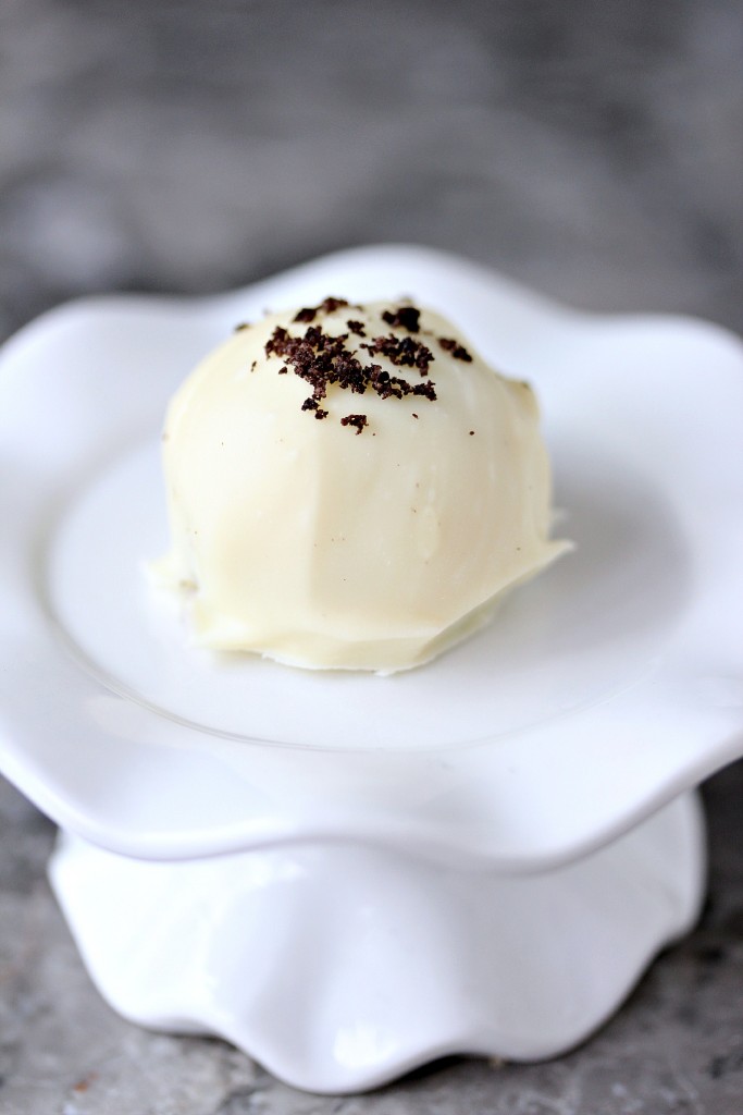 white chocolate oreo cookie ball on a tiny white serving dish
