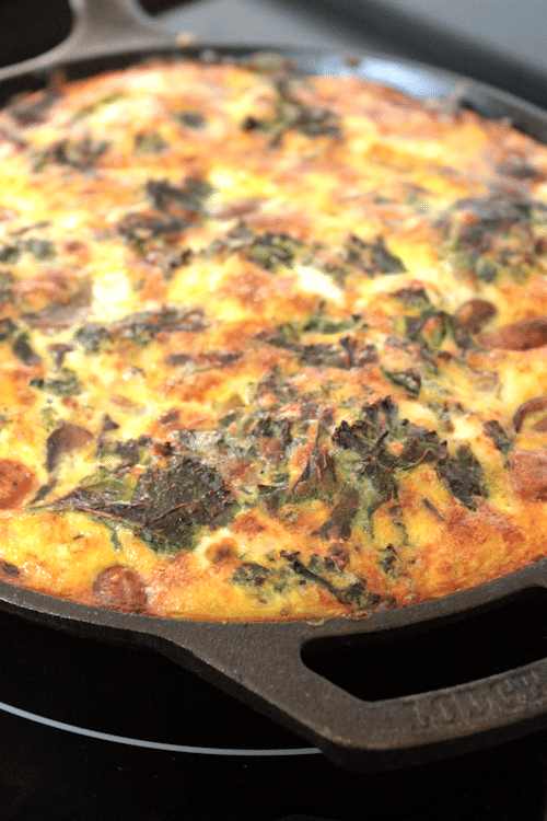 Overhead image of frittata cooked in a cast iron pan