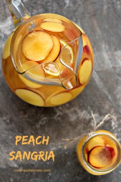 Peach Sangria served in a glass pitcher and mason jar