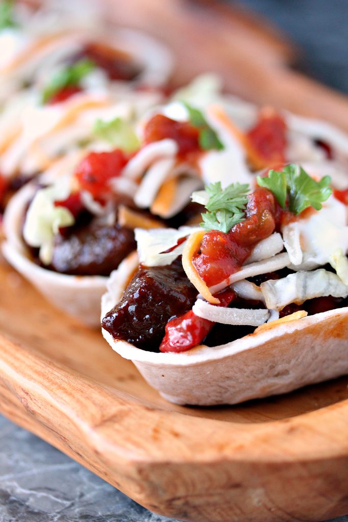 Steak Bites Mini Taco Boats from cravingsofalunatic.com- This taco recipe uses steak marinated in beer, then cooked to perfection in a cast iron skillet, and topped with Barbecue Sauce. It's Tex-Mex in mini form. Every bite is full of flavour. (@CravingsLunatic)