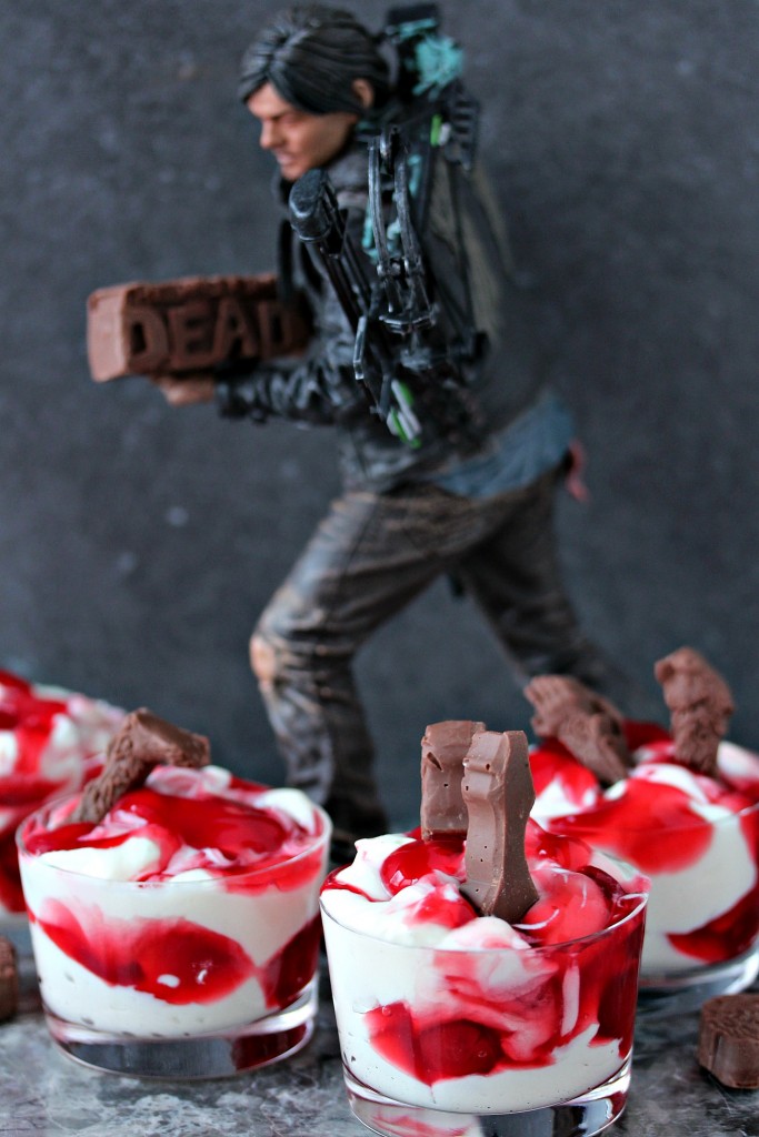 cherry dip in glass dishes with a statue of daryl dixon holding a chocolate piece