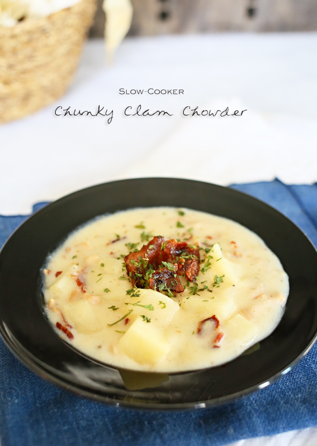 Slow Cooker Clam Chowder – Kleinworth & Co. image of finished recipe in a dark bowl on a white napkin on a white surface. 