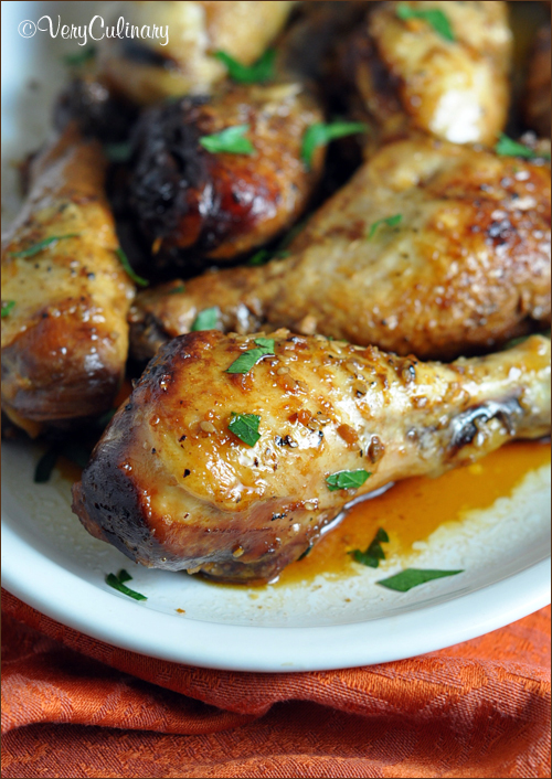 Slow Cooker Honey-Soy Chicken Drumsticks – Belly Full image of finished recipe on a white plate. 