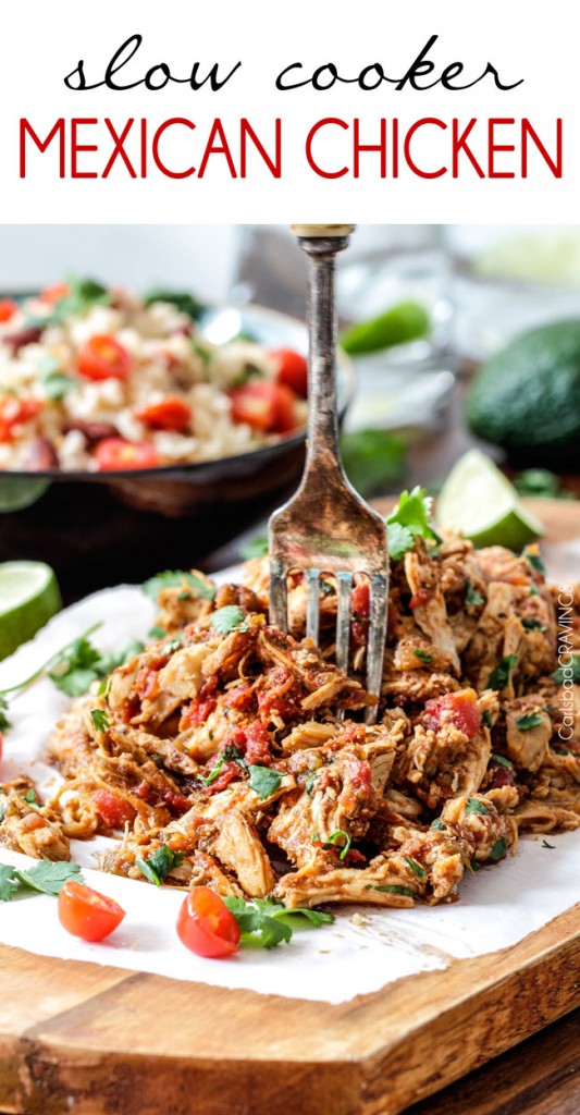 Slow Cooker Mexican Chicken – Carlsbad Cravings image of finished recipe on a wood board with a fork stuck in the meat.