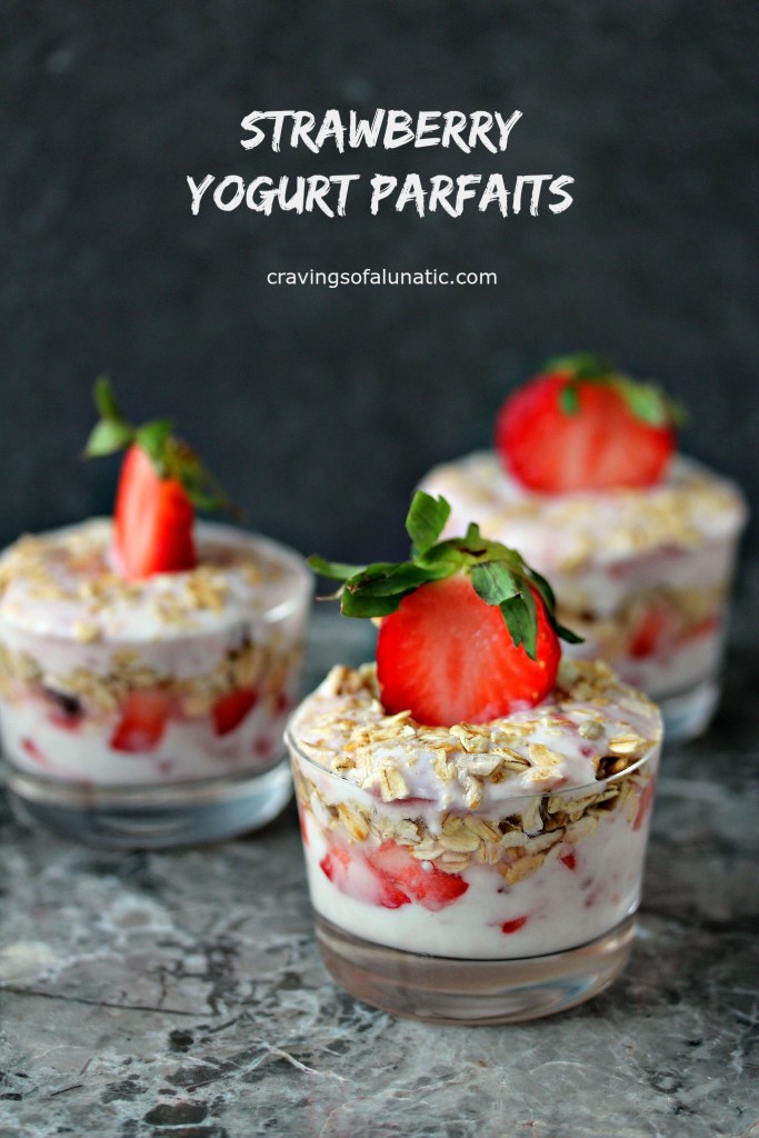 Strawberry Yogurt Parfaits served in tiny glass jars