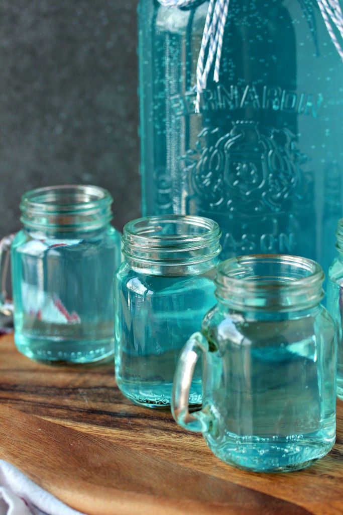 Toilet water served in mason jars on a wood serving board/