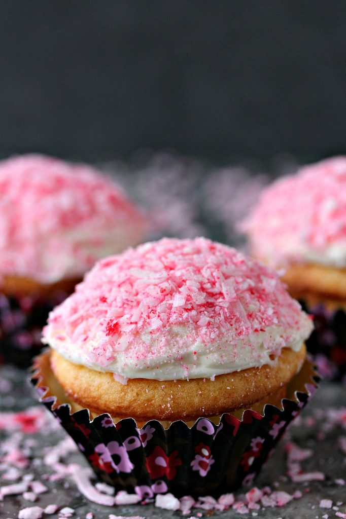 Pink Coconut Cupcakes from cravingsofalunatic.com- Pink Coconut Cupcakes made with Pillsbury Cake Mix, then filled with surprise inside coconut frosting, and topped with pink coconut. (@CravingsLunatic)