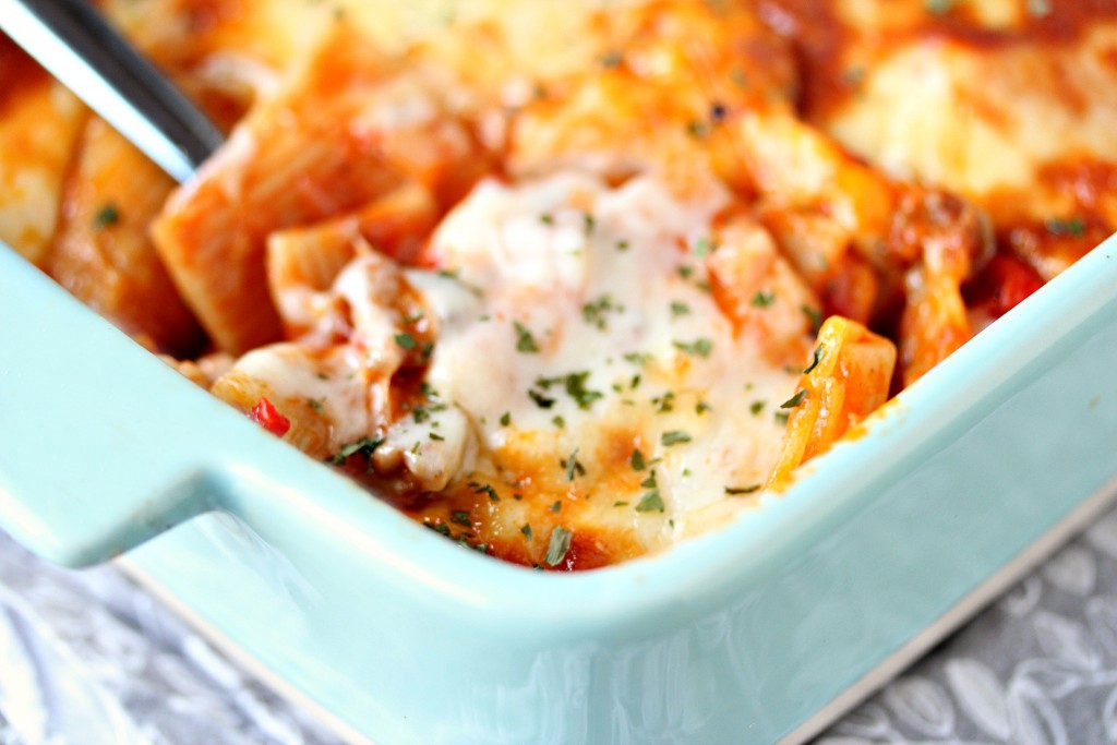 Easy Cheesy Pasta Bake with Sausage and Peppers in a blue casserole dish.