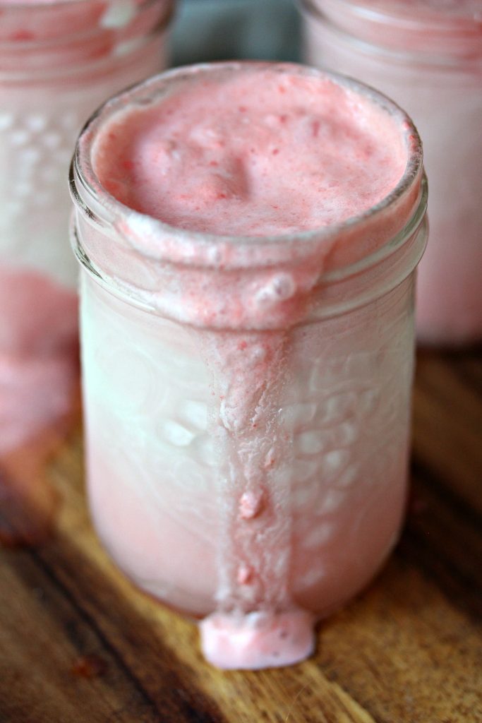 close up image of mason jar filled with Cherry Limeade Ice Cream Floats