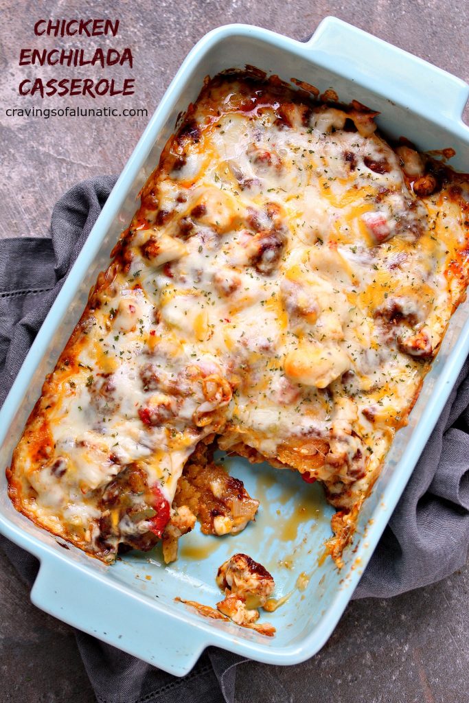 image of chicken enchilada casserole cooked in a blue casserole dish 