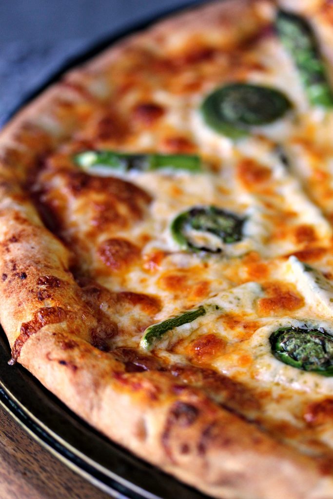 Close up image of Fiddlehead and Asparagus Pizza