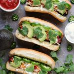 These hot dogs are grilled to perfection, then topped with jalapeno peppers, salsa, cheese, sour cream and avocados. This recipe is a real crowd pleaser.