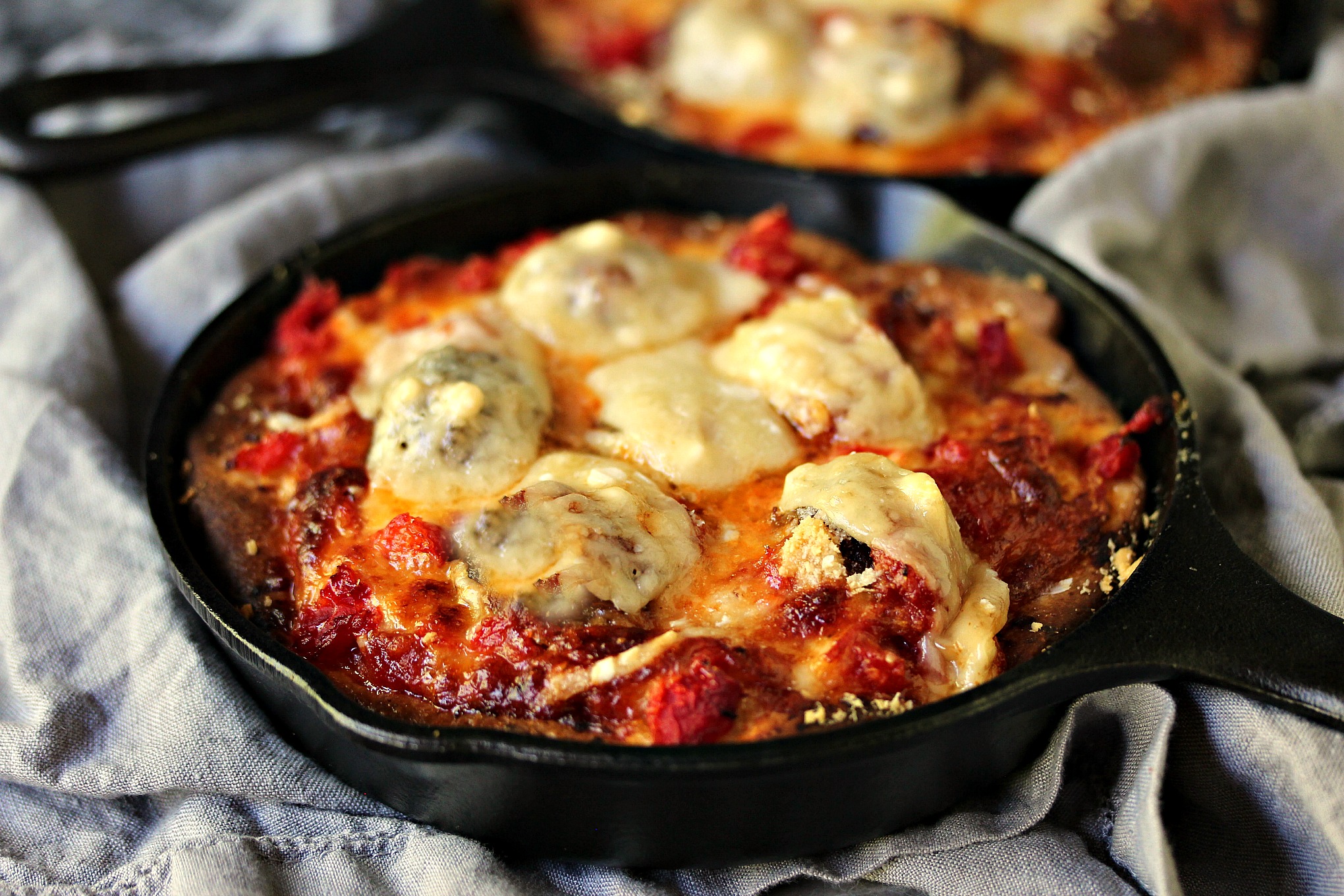 Mini Meatball Pizzas from cravingsofalunatic.com- Mini pizzas are always a huge hit with family and friends. This recipe is packed full of meatballs and cheese. Big flavour served in mini cast iron pans. (@CravingsLunatic)