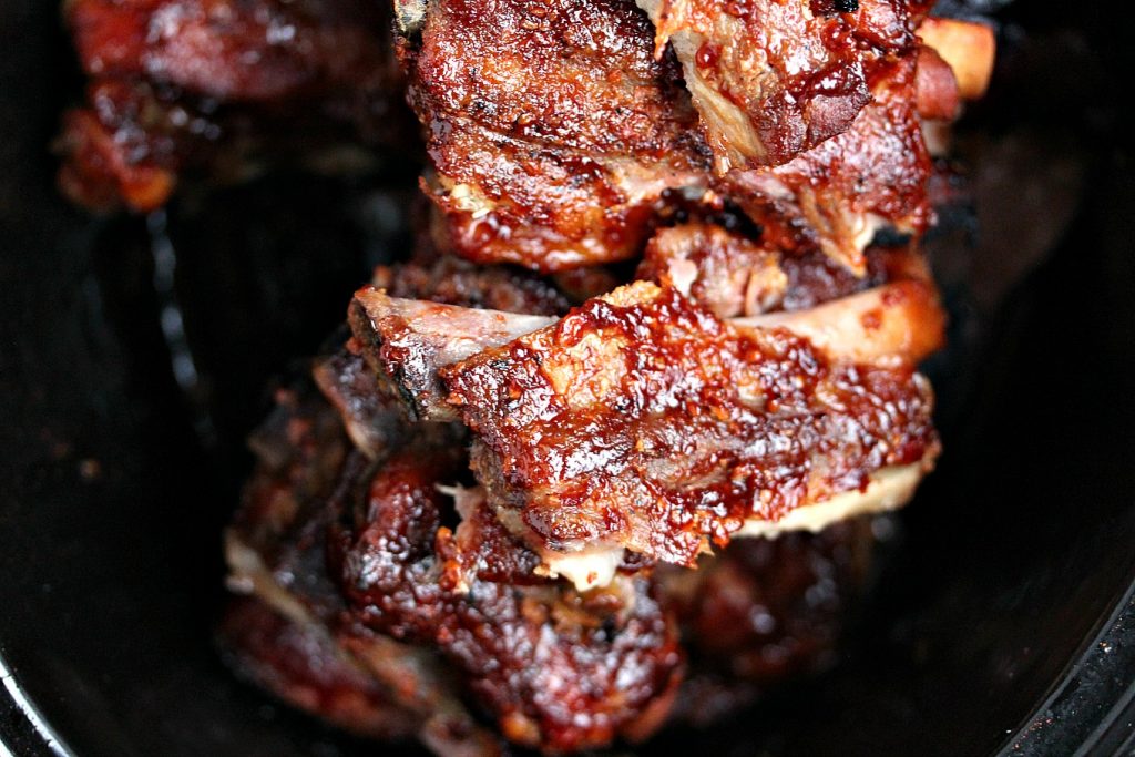 Slow Cooker Spare Ribs in a black crock pot insert.