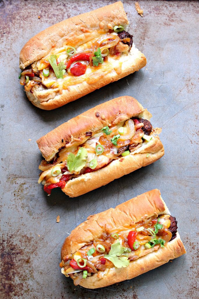 The Tex Mex Meatball Sub is perfect for any occasion. Mini sub buns are stuffed with meatballs smothered in enchilada sauce, topped with roasted red peppers, caramelized onions and a Mexican 4 Cheese Blend. 