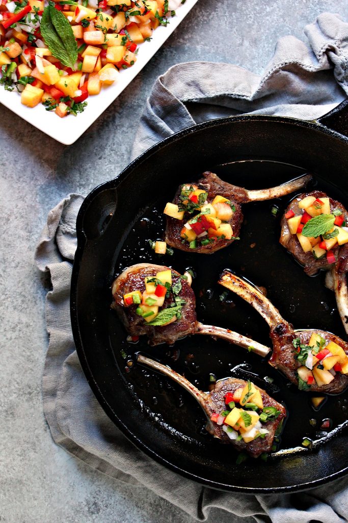 Lamb Lollipops with Peach Salsa from cravingsofalunatic.com- This lamb lollipop recipe is quick and easy, yet packed with flavour. The lamb is seared, then topped with an easy peach salsa recipe. A stunning meal on the table in under 20 minutes. @CravingsLunatic