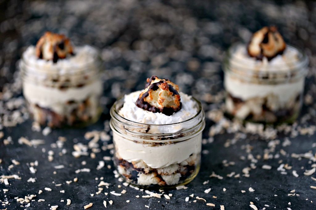 Coconut Macaroon Cheesecake Parfaits served in tiny mason jars
