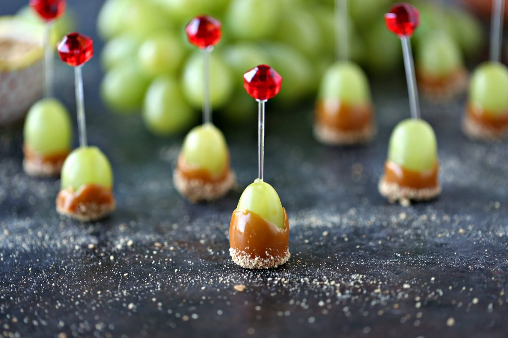 Caramel Dipped Grapes on toothpicks.