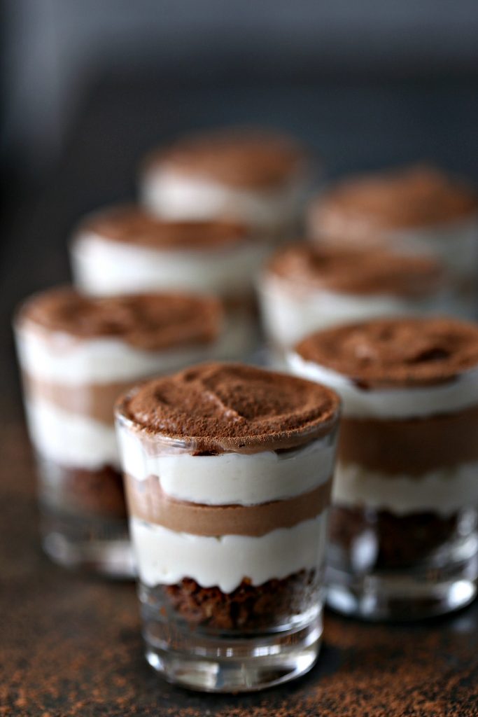 small glasses of of layered No-Bake Chocolate and Coffee Mini Cheesecakes 