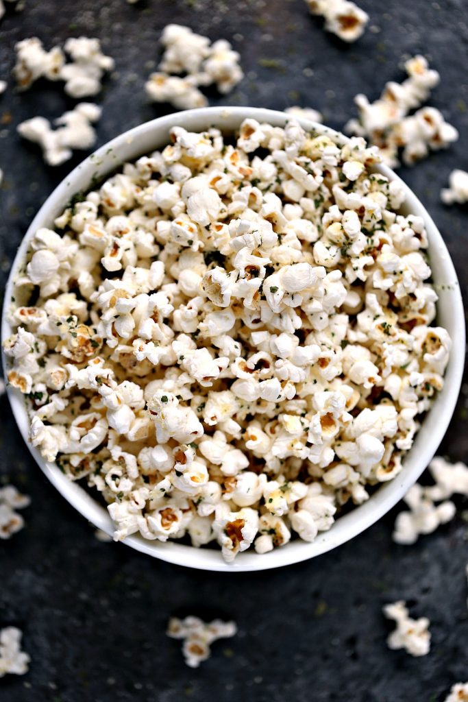 Parmesan Popcorn Recipe from cravingsofalunatic.com- Enjoy a late afternoon treat with this Parmesan Popcorn recipe. Air-popped popcorn topped with parmesan cheese and dried parsley. Perfect for an afternoon treat!