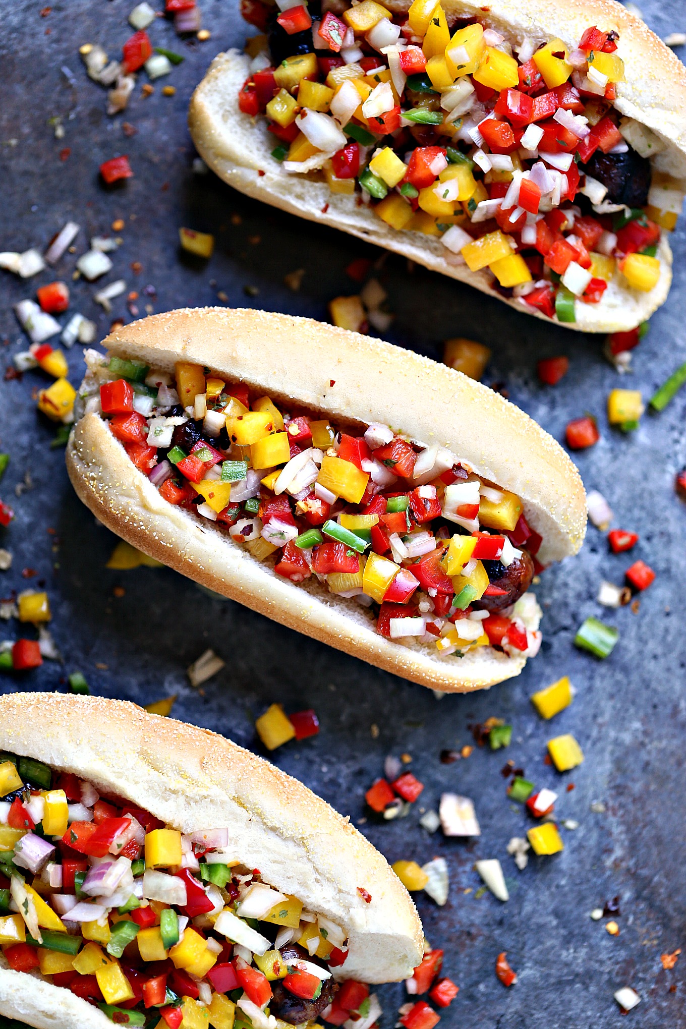 Grilled Beer Brats with Boozy Salsa from cravingsofalunatic.com- Fire up your grill this weekend and make these amazing grilled beer brats. Top with boozy salsa filled with bell peppers, onions, shallots, jalapeno peppers and garlic.