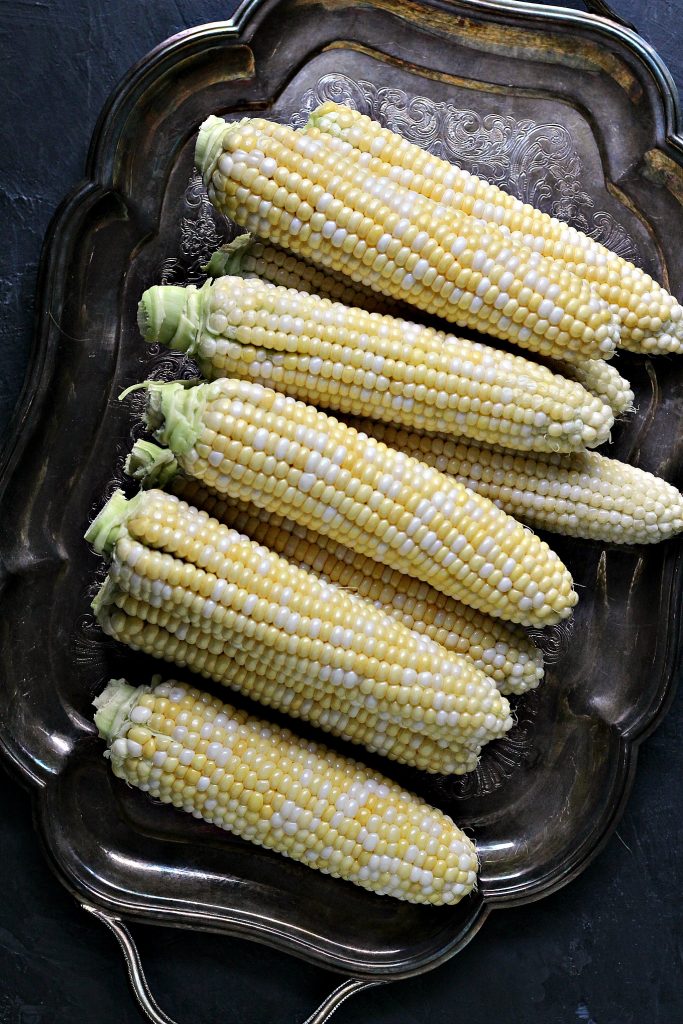 Corn on the Cob ready to turned into a perfect side dish. This Mexican Street Corn Salad is the perfect mix of sweet, salty, and spicy. It's all combined to make an amazing Esquites recipe that will satisfy your corn cravings.