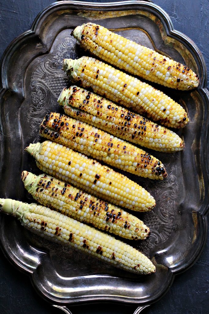Grilled Corn on the Cob ready to turned into a perfect side dish. This Mexican Street Corn Salad is the perfect mix of sweet, salty, and spicy. It's all combined to make an amazing Esquites recipe that will satisfy your corn cravings.
