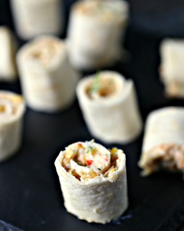 Chicken Fajita Mini Roll Ups {Pinwheels) from cravingsofalunatic.com- These chicken fajita roll ups are tiny in size but big on flavour! These are perfect to pack in lunches or to use as appetizers for parties.