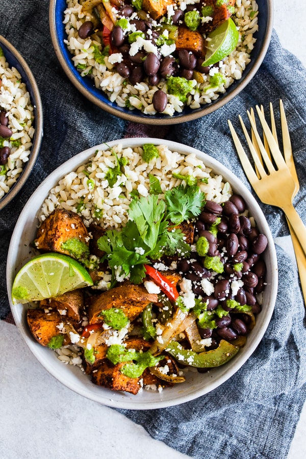 Sweet Potato Black Bean Burrito Bowls from Nutmeg Nanny. These sweet potato black bean burrito bowls are the perfect vegetarian meal to add to your weekly meal plan. Delicious cilantro lime rice piled high with black beans, roasted sweet potatoes, and vegetables. Trust me, you’ll go crazy over this bowl!