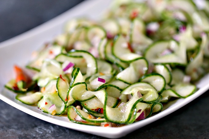close up image of Thai Cucumber Salad on a white plate