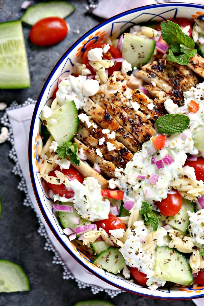 overhead image of Greek chicken orzo power bowls in big bowl