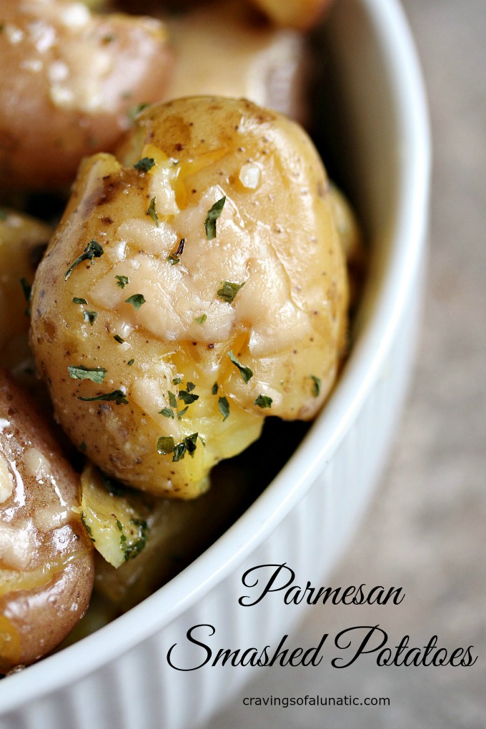 close up image of parmesan smashed potatoes in a white bowl 