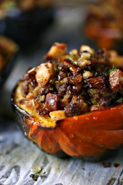 Stuffed Acorn Squash loaded with lots of bacon, Italian sausage, bread crumbs, spices and drizzled with honey! Perfect for Fall!
