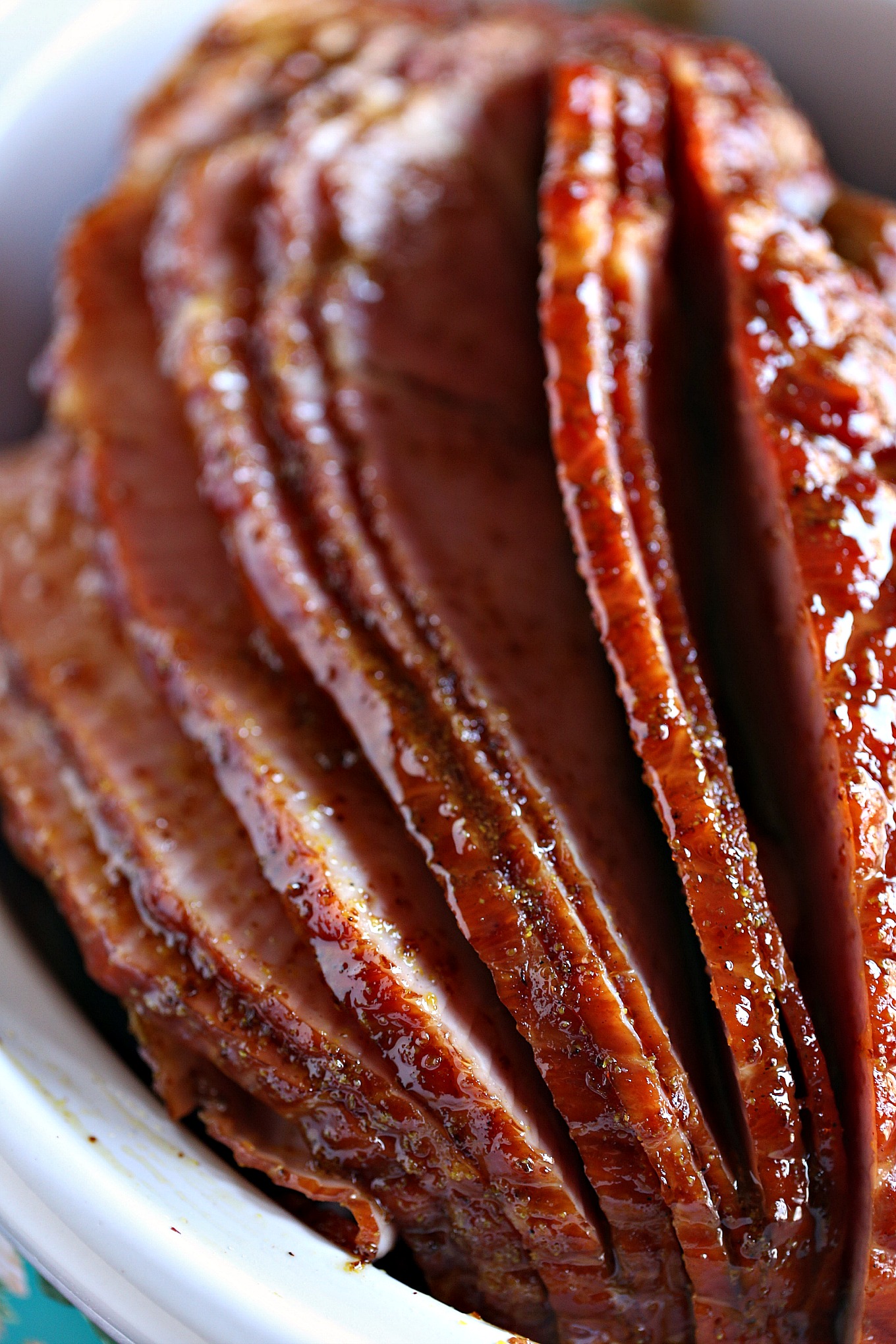 Slow Cooker Ham cooked in a crockpot with a beautiful honey mustard glaze brushed over top.