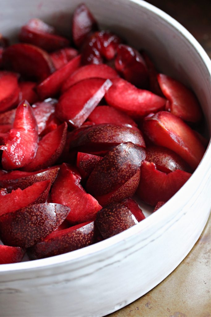 Plums sliced in a bowl