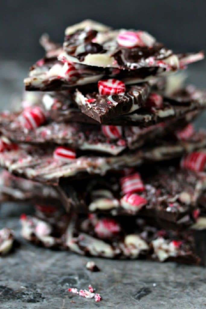 Pieces of chocolate peppermint bark stacked on a counter.