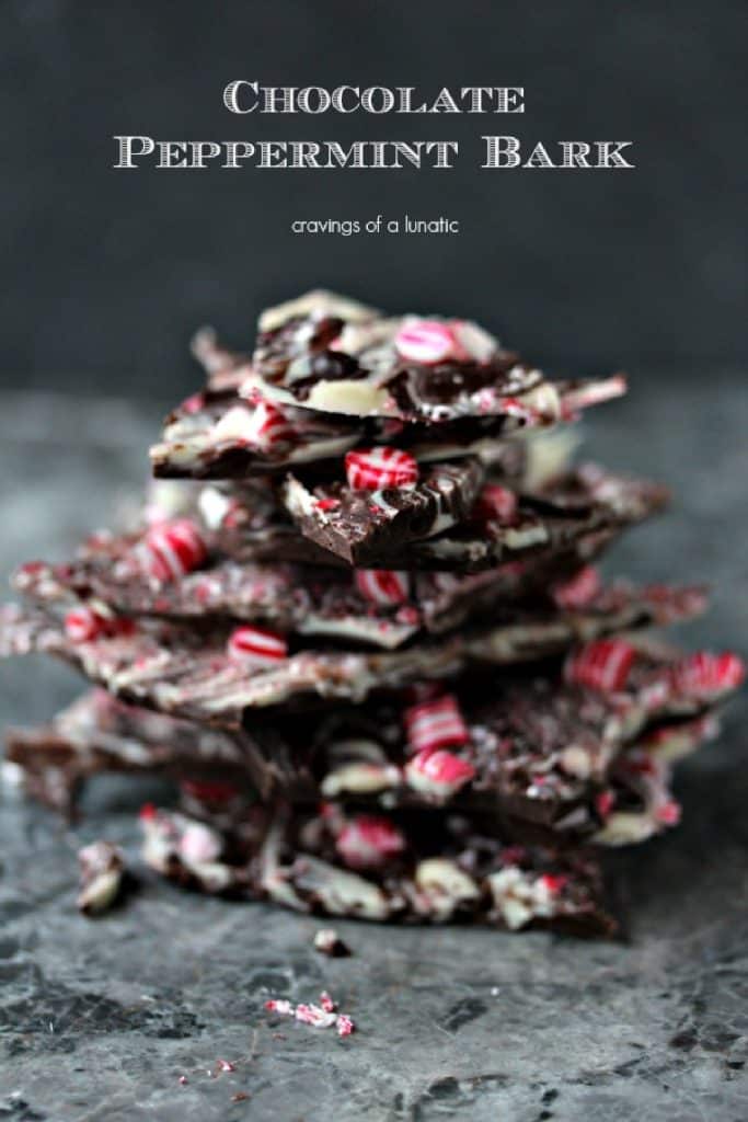 Pieces of chocolate peppermint bark stacked up on a counter.
