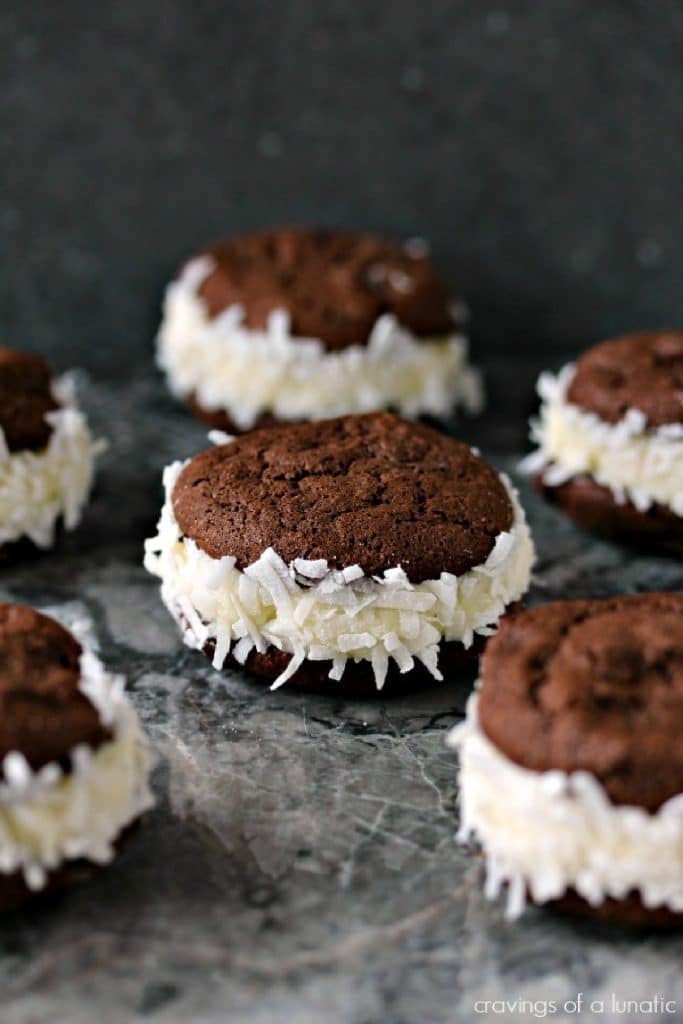 Coconut Filled Sandwich Cookies on a grey counter.
