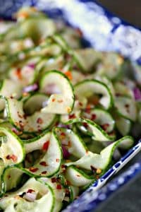 Thai cucumber salad in a blue and white square dish.