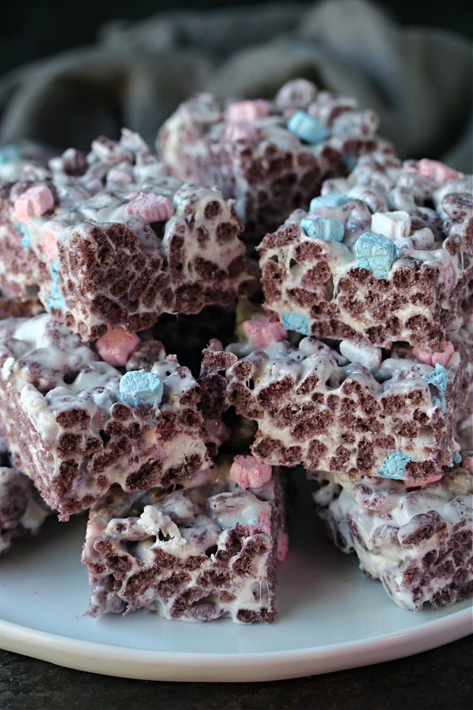 Boo berry krispie treats served on a white plate.