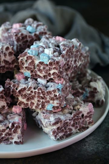 Boo berry krispie treats on a white plate.